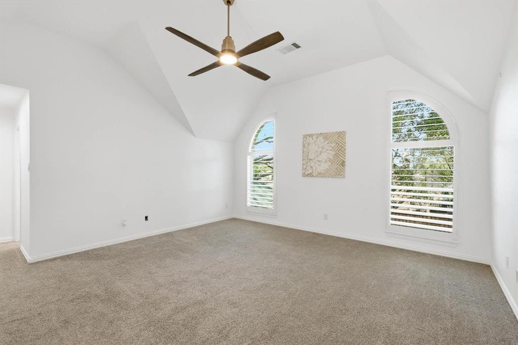 3408 Druid Way Flower Mound, TX 75028 - Photo 21 of 36 en empty room with windows and fan