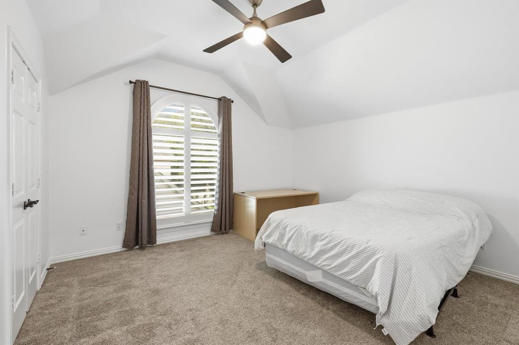 3408 Druid Way Flower Mound, TX 75028 - Photo 22 of 36 a bedroom with a bed and ceiling fan