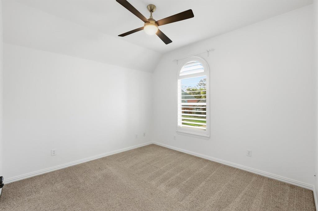 3408 Druid Way Flower Mound, TX 75028 - Photo 24 of 36 an empty room with a window and ceiling fan