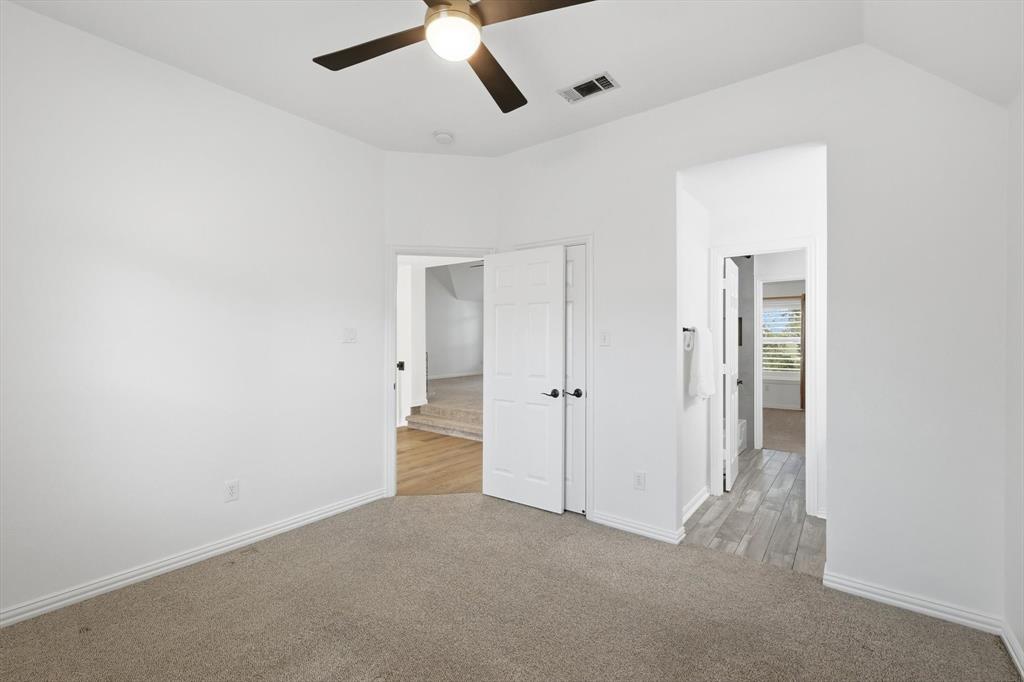 3408 Druid Way Flower Mound, TX 75028 - Photo 25 of 36 an empty room with closet and windows