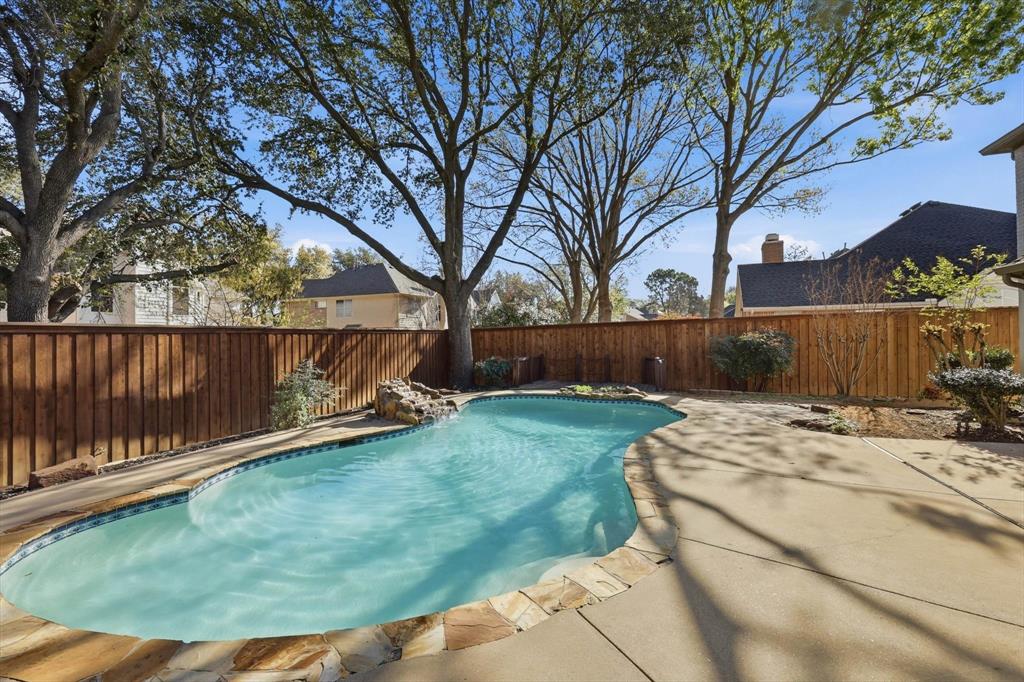 3408 Druid Way Flower Mound, TX 75028 - Photo 34 of 36 a view of a backyard with a fence and trees