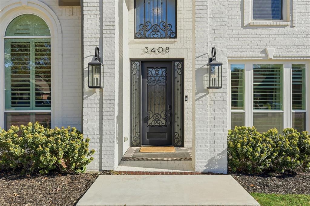 3408 Druid Way Flower Mound, TX 75028 - Photo 4 of 36 a front view of a house with a garden