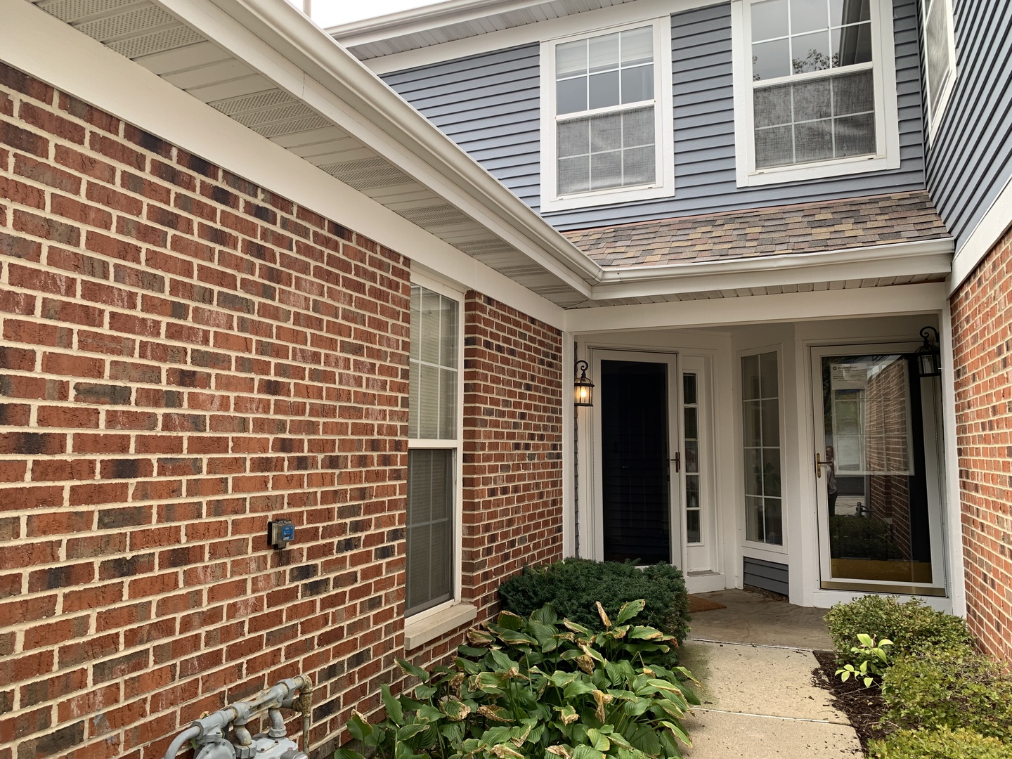 2008 North Silver Lake Road Arlington Heights, IL 60004 - Photo 2 of 17 a view of a brick house with potted plants