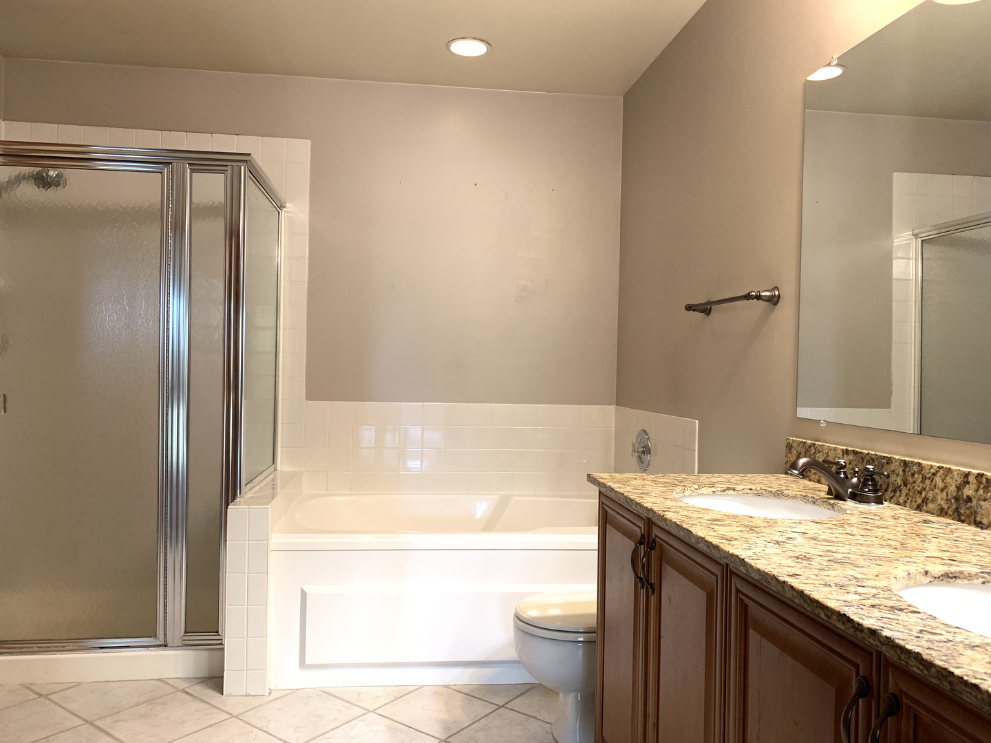 2008 North Silver Lake Road Arlington Heights, IL 60004 - Photo 13 of 17 a bathroom with a granite countertop bathtub sink vanity and toilet
