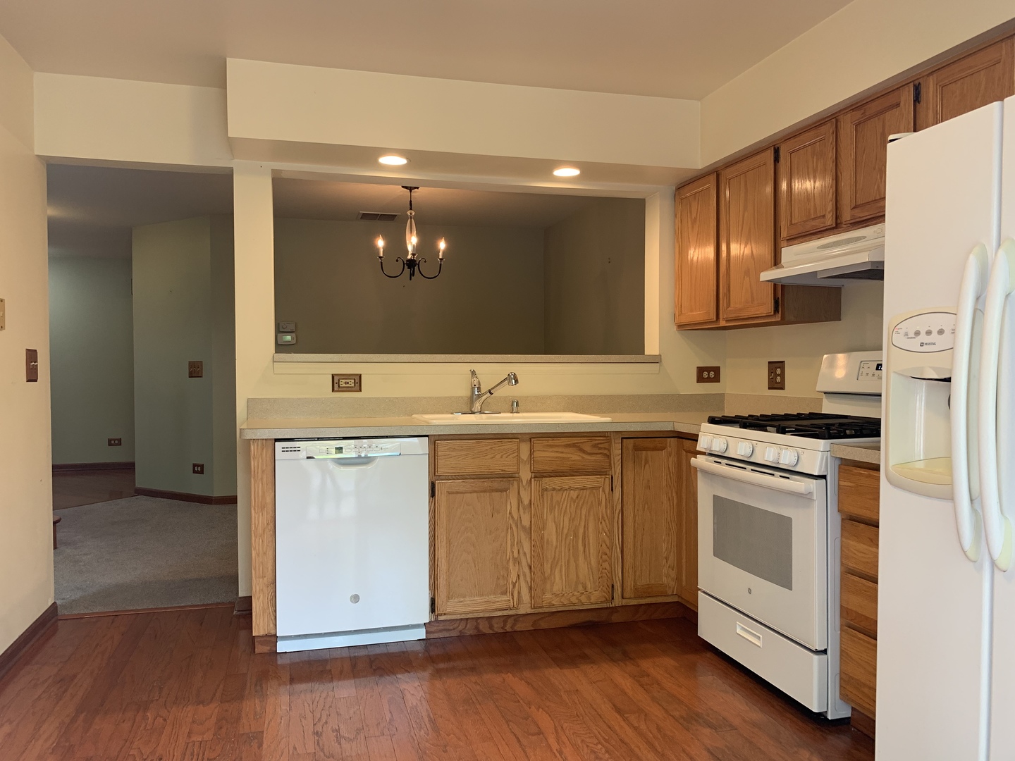 2008 North Silver Lake Road Arlington Heights, IL 60004 - Photo 8 of 17 a kitchen with stainless steel appliances white cabinets and a wooden floor