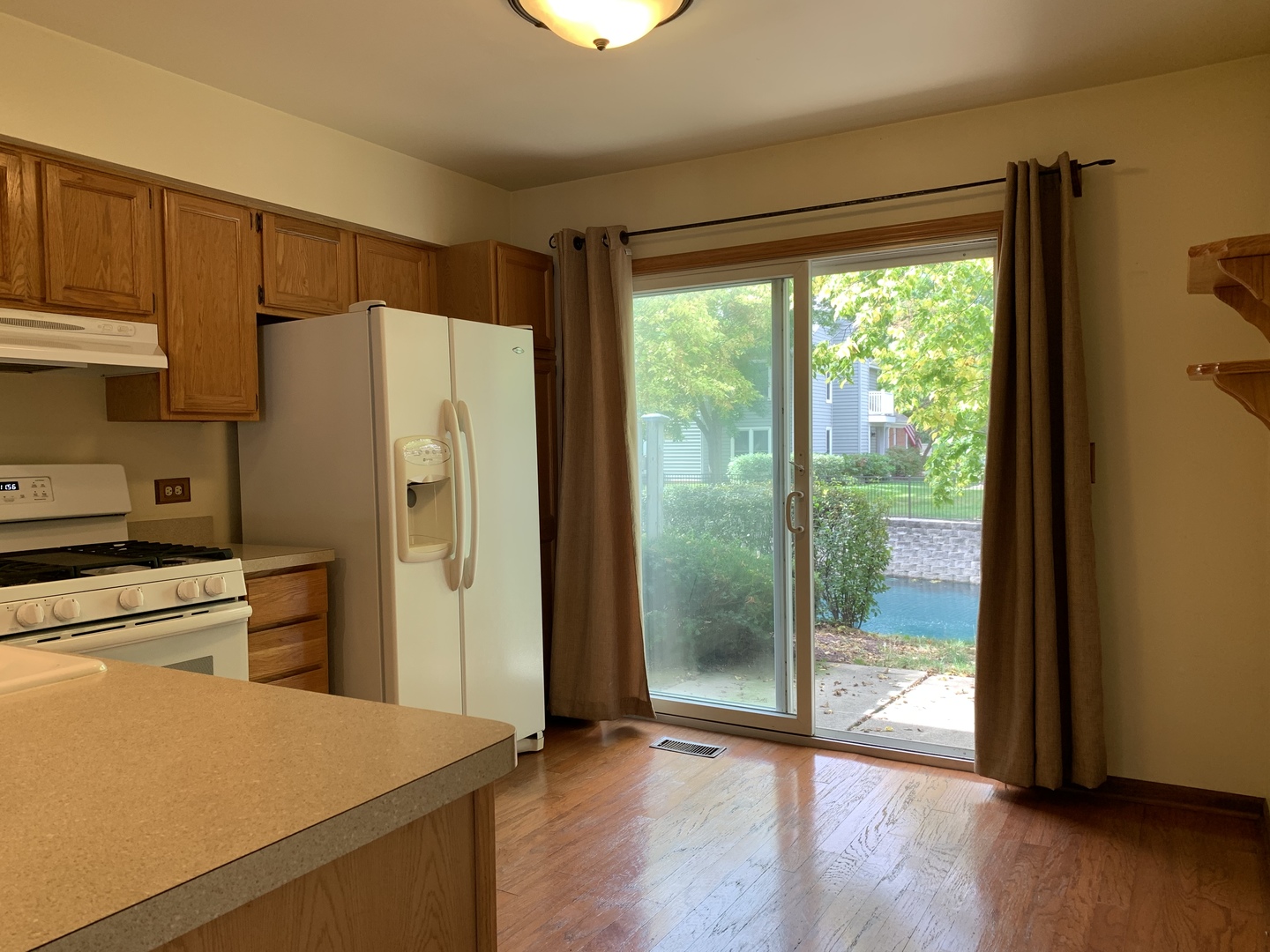 2008 North Silver Lake Road Arlington Heights, IL 60004 - Photo 9 of 17 a kitchen with a refrigerator a stove top oven