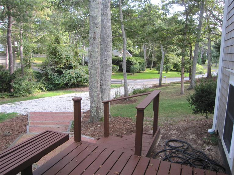 116 Harbor Hills Road Centerville, MA 02632 - Photo 3 of 25 a view of a deck with a backyard and couches