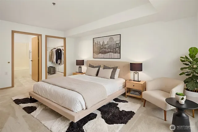 a bedroom with a bed and a couch