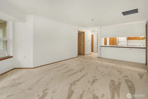 a view of a kitchen with a dishwasher and a refrigerator