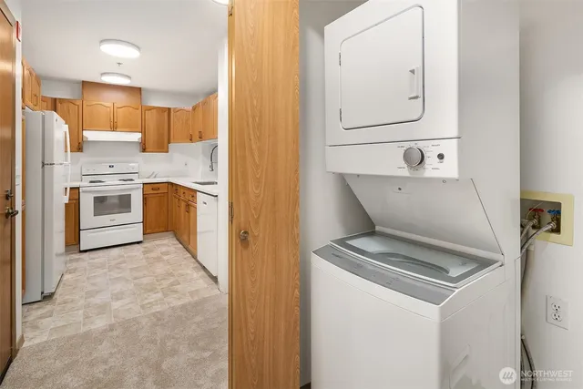 a kitchen with a sink stove and refrigerator