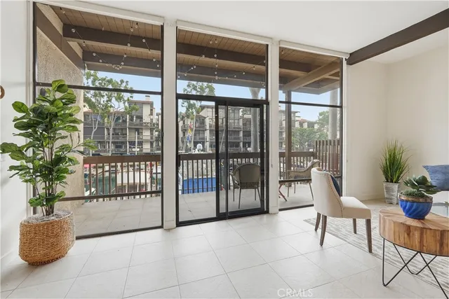 a living room with furniture and potted plant