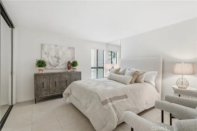 a bedroom with a bed and a couch