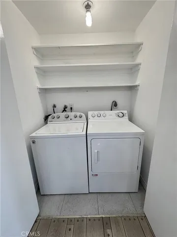 a utility room with washer and dryer