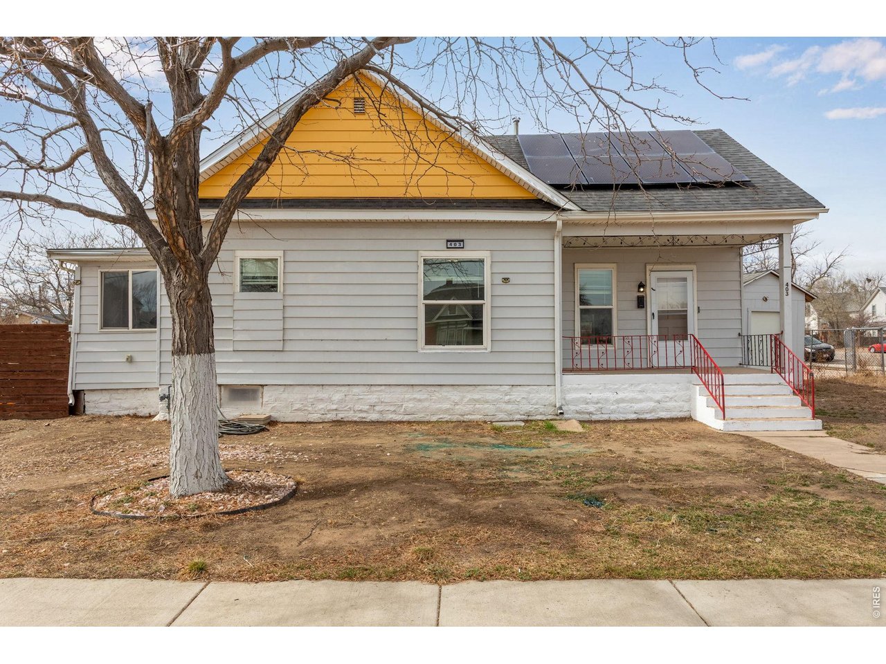 403 9th Avenue Greeley, CO 80631 - Photo 2 of 19 a view of a house with a backyard