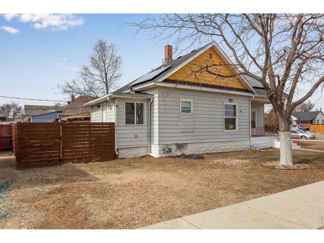 403 9th Avenue Greeley, CO 80631 - Photo 3 of 19 a view of a house with wooden fence