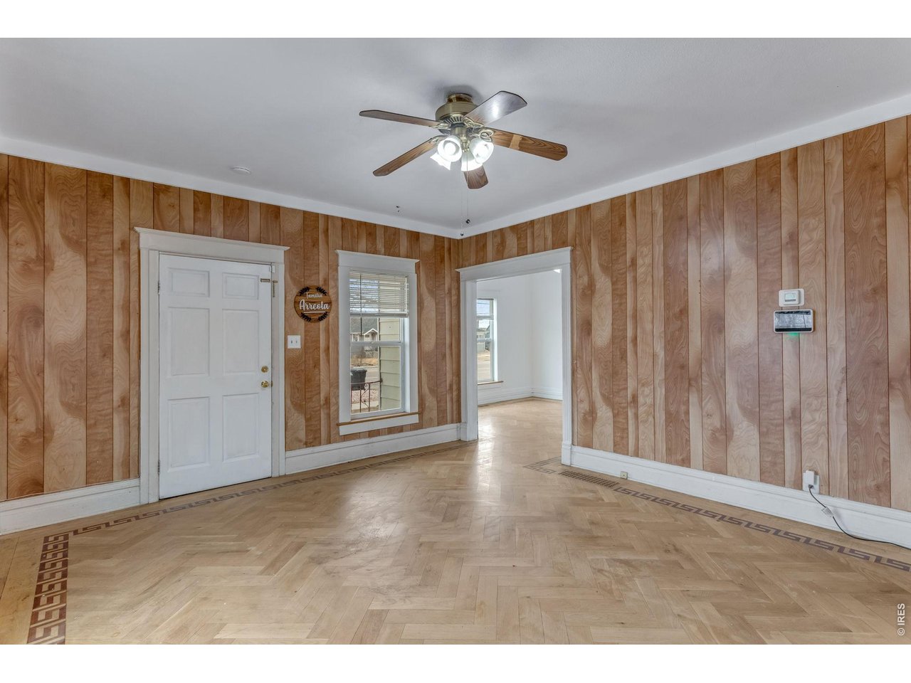 403 9th Avenue Greeley, CO 80631 - Photo 5 of 19 a view of an empty room with a window