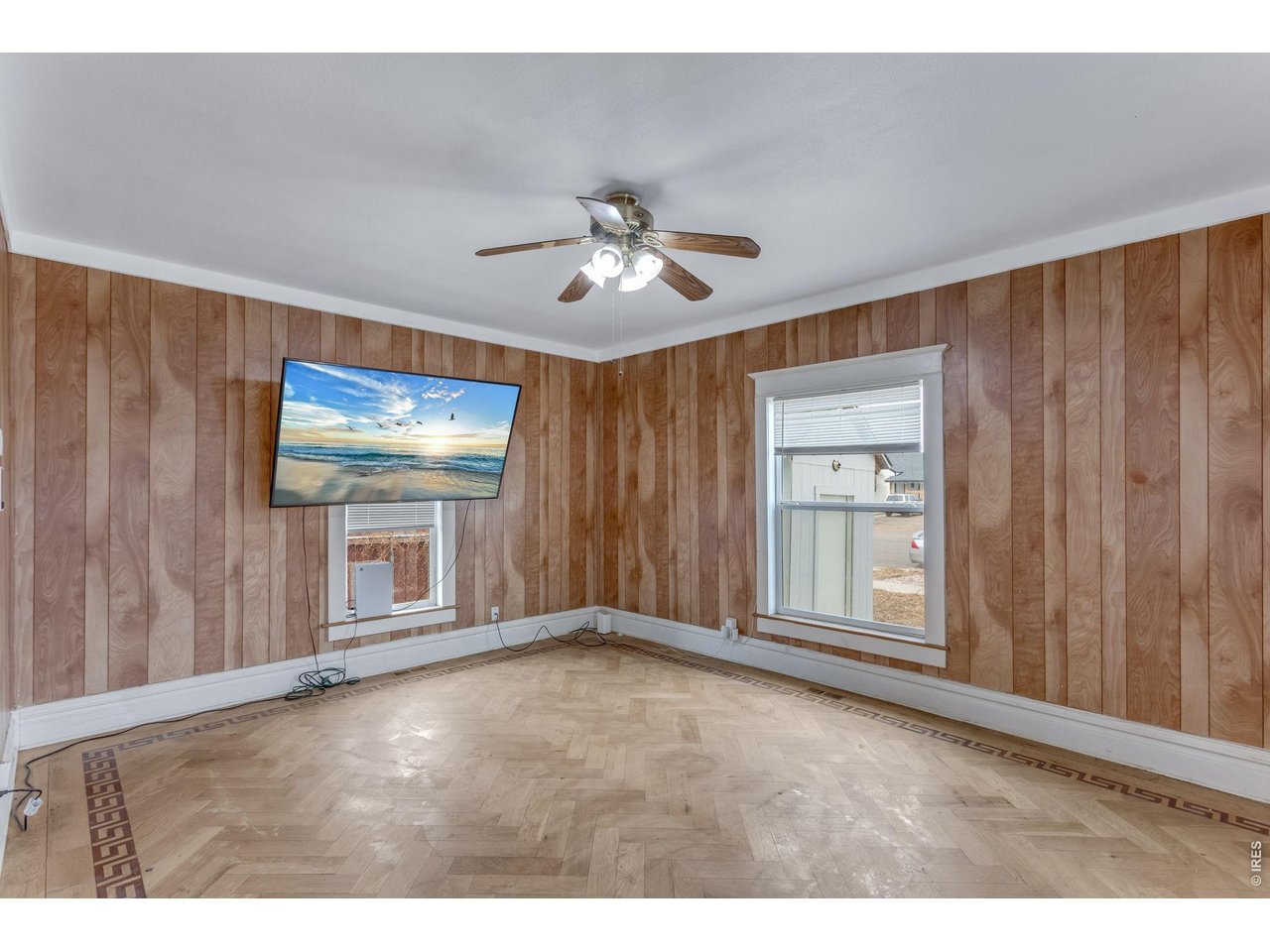 403 9th Avenue Greeley, CO 80631 - Photo 7 of 19 a view of an empty room with a window