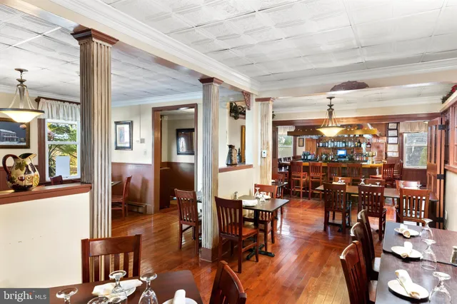 a living room with lots of furniture and white walls