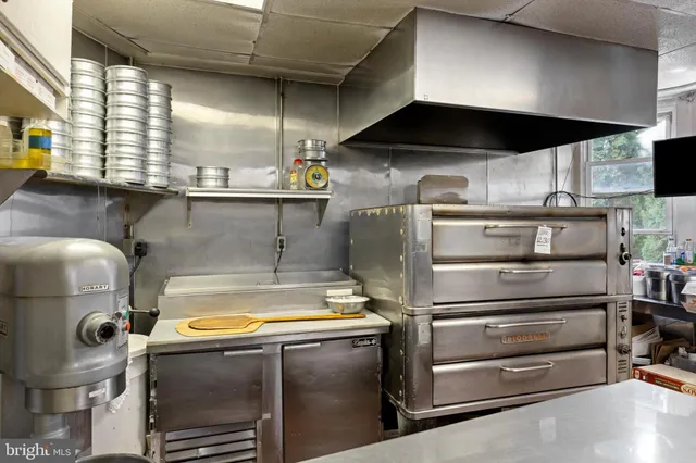 a kitchen with a stove and a microwave