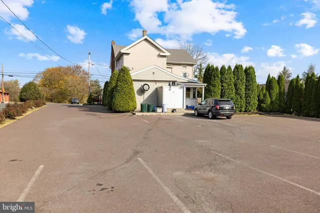 a view of a car park in front of a house