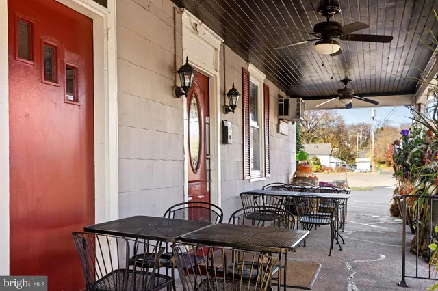 a table and chairs sitting in front of a building