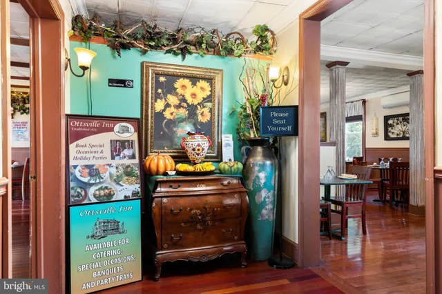 a view of living room with furniture and a fireplace