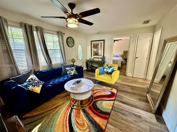 a living room with furniture and a large window