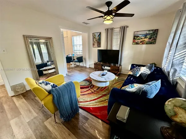 a living room with furniture and a flat screen tv