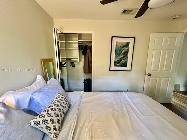 a bedroom with a bed and a couch