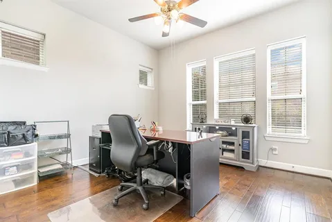 a dining room with table and chairs