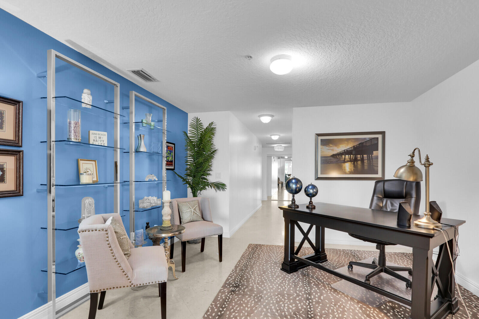 700 Ocean Royale, Unit 202 Juno Beach, FL 33408 - Photo 12 of 34 a living room with furniture and a window