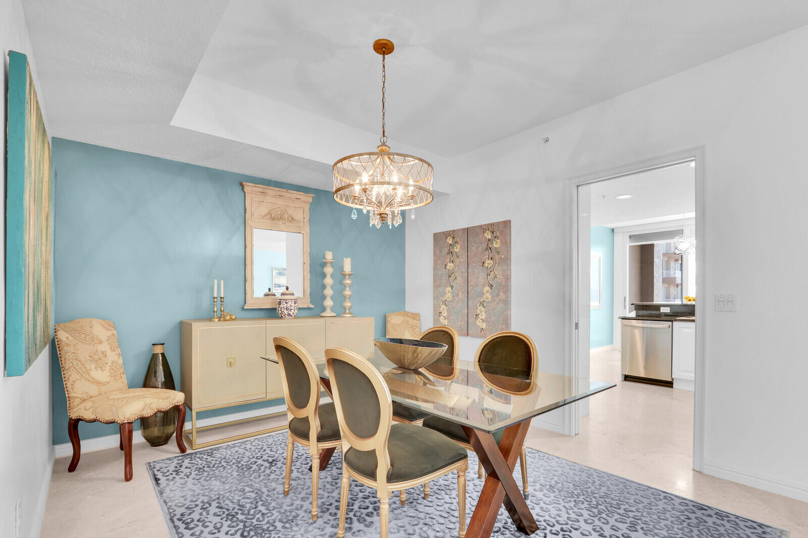 700 Ocean Royale, Unit 202 Juno Beach, FL 33408 - Photo 13 of 34 a view of a dining room with furniture and chandelier