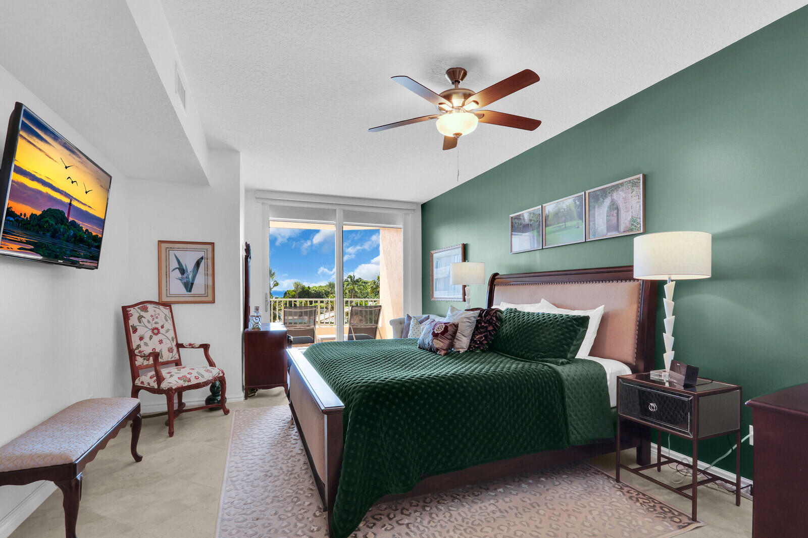700 Ocean Royale, Unit 202 Juno Beach, FL 33408 - Photo 15 of 34 a bedroom with a bed and a flat screen tv