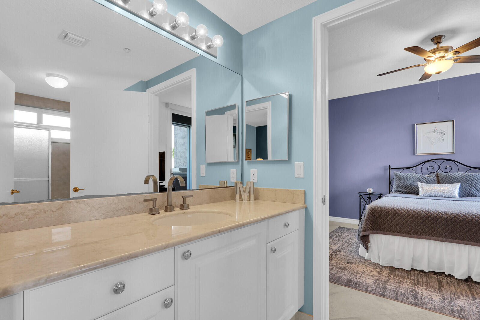 700 Ocean Royale, Unit 202 Juno Beach, FL 33408 - Photo 20 of 34 a spacious bathroom with a double vanity sink and a mirror