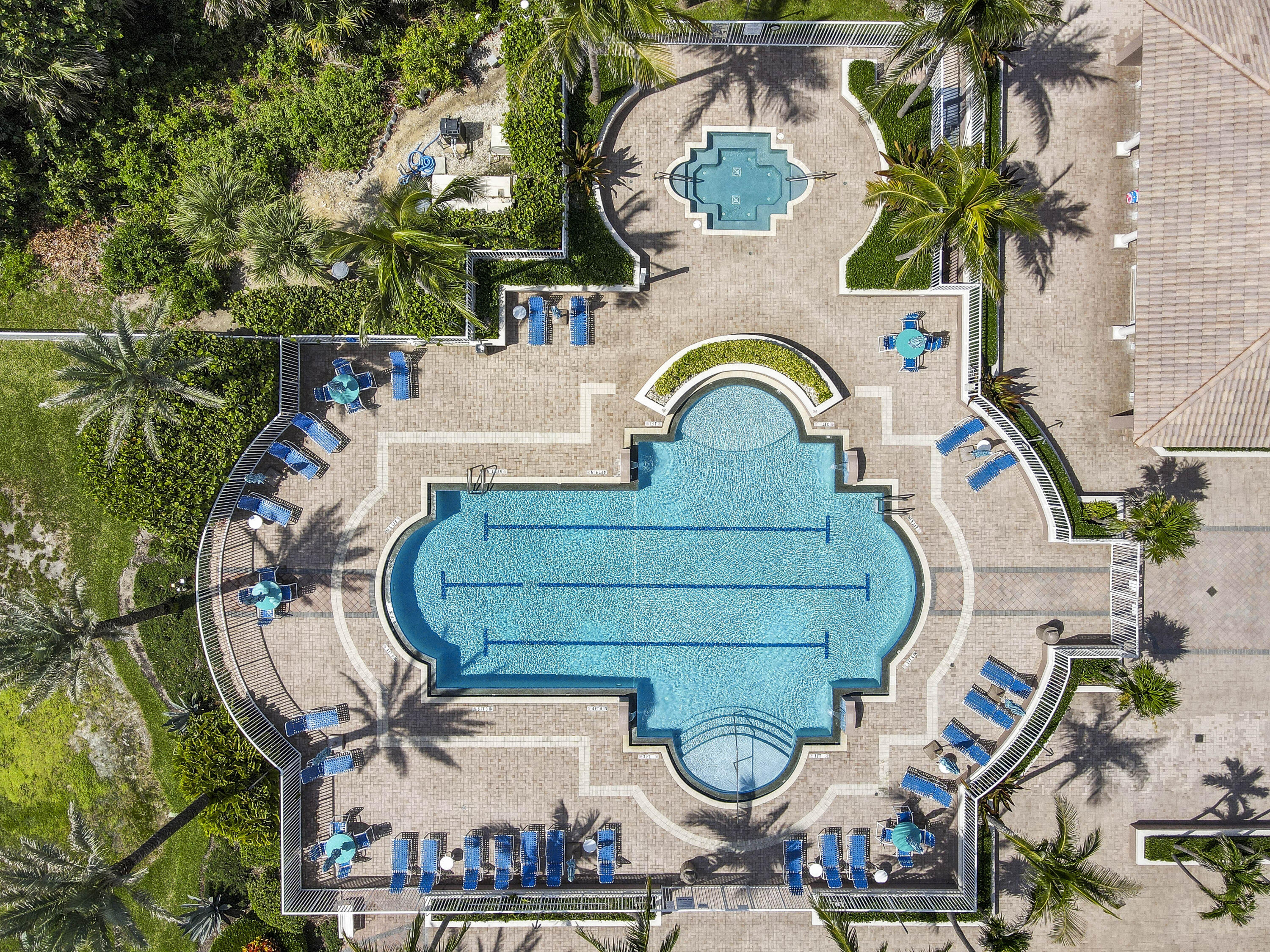 700 Ocean Royale, Unit 202 Juno Beach, FL 33408 - Photo 2 of 34 an aerial view of a house with garden space and swimming pool