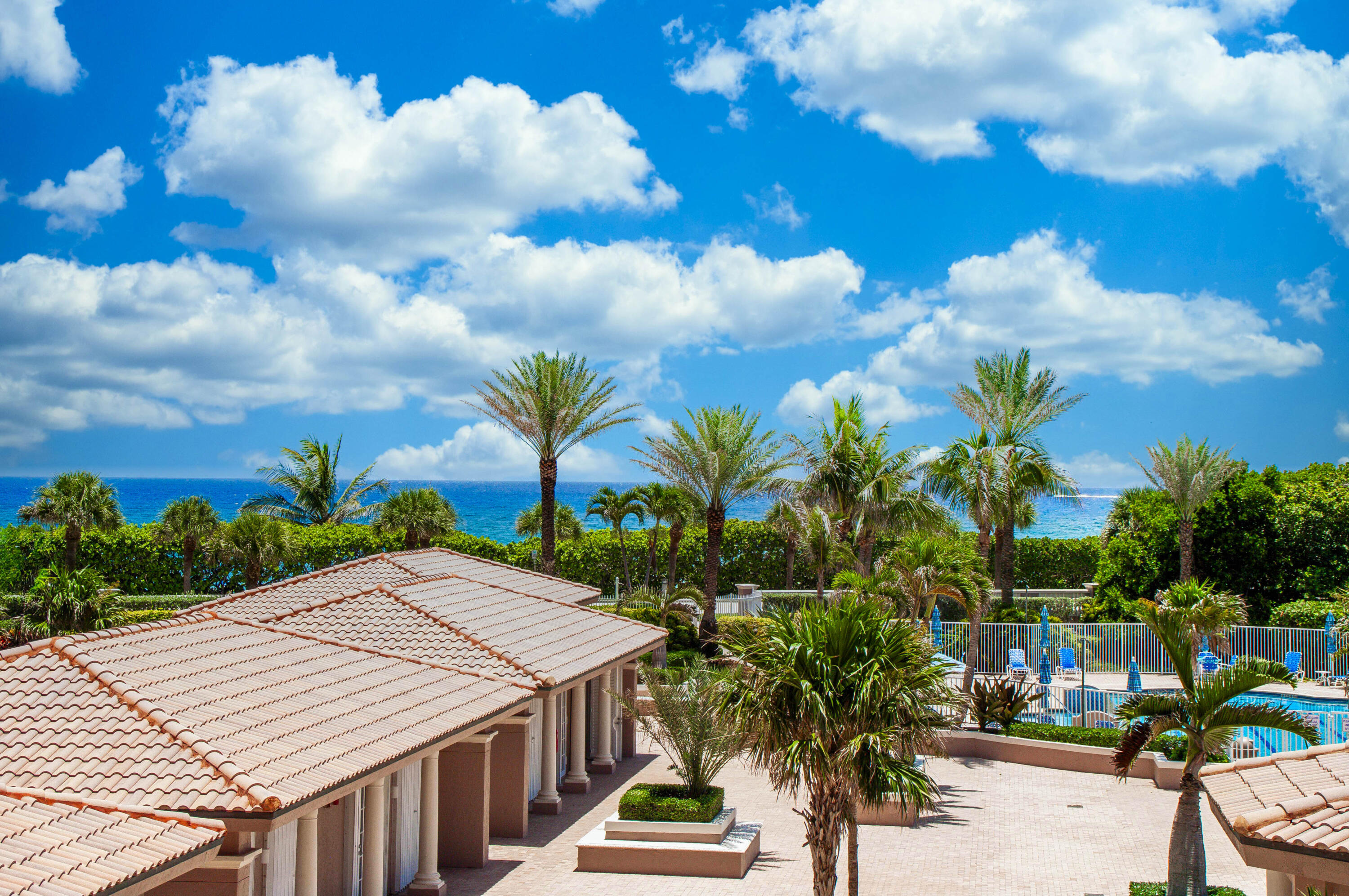 700 Ocean Royale, Unit 202 Juno Beach, FL 33408 - Photo 3 of 34 a view of a patio with table and chairs and potted plants
