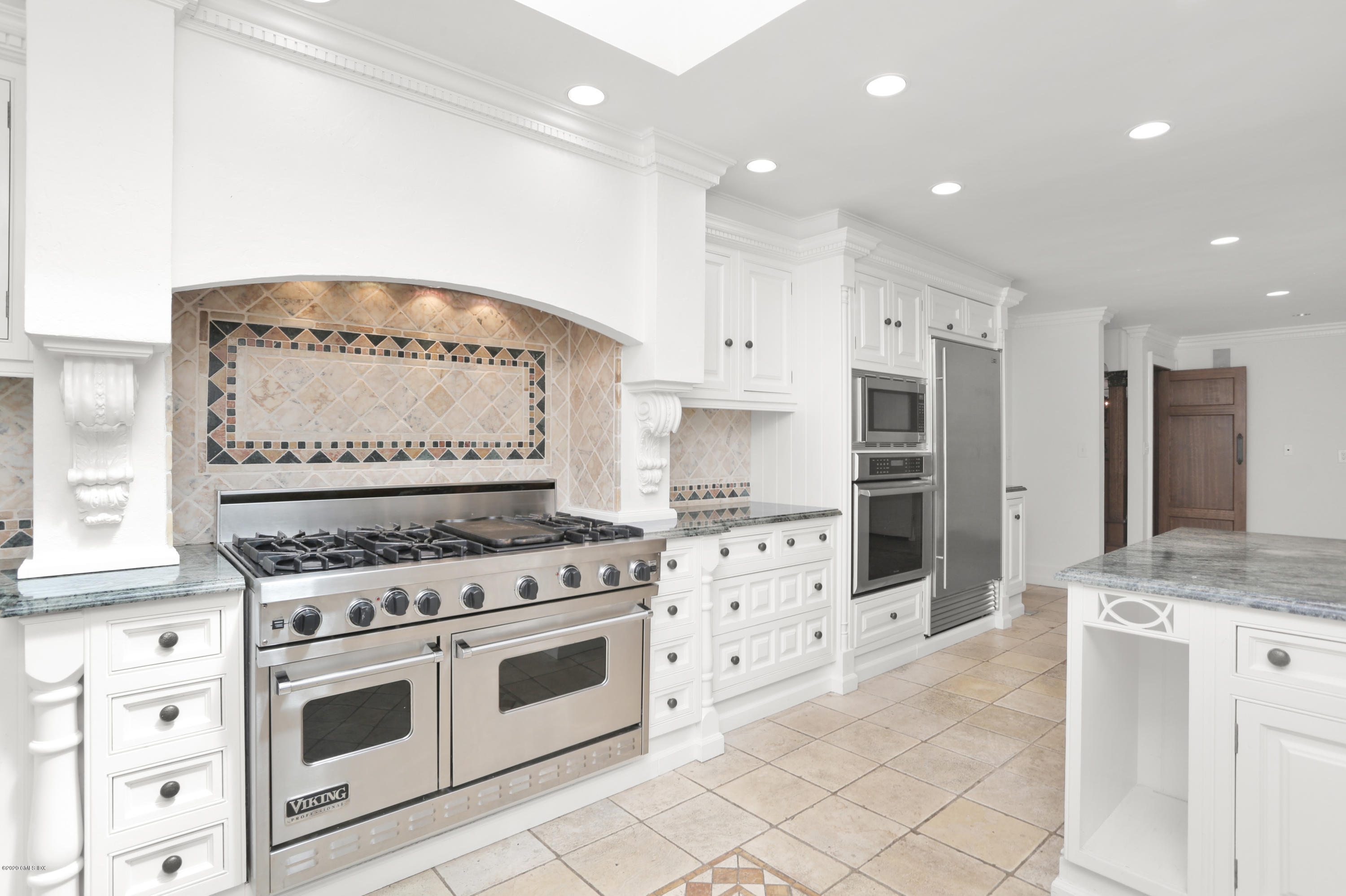 558 Lake Avenue Greenwich, CT 06830 - Photo 11 of 28 a kitchen with stainless steel appliances white cabinets and a stove