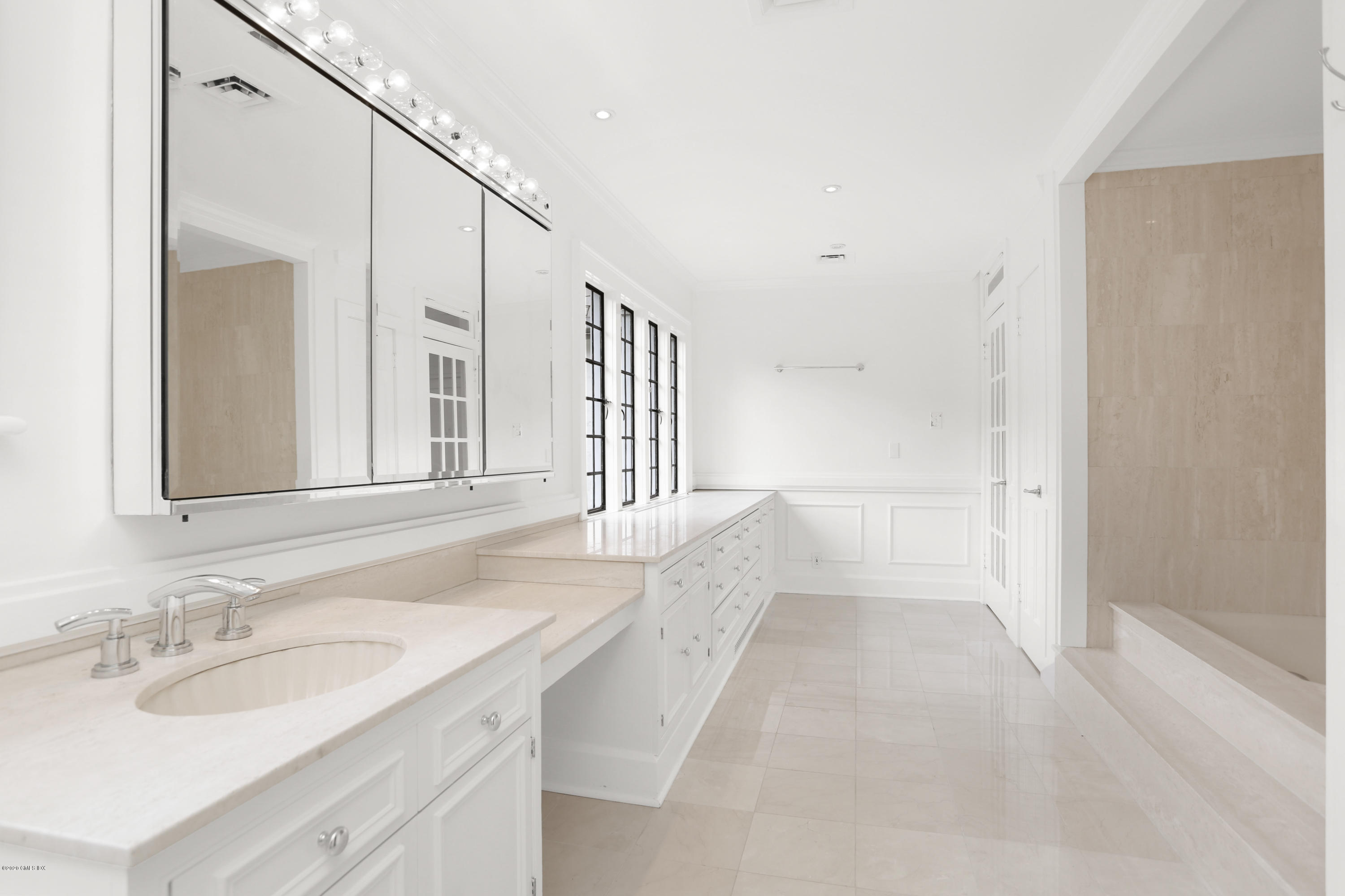 558 Lake Avenue Greenwich, CT 06830 - Photo 15 of 28 a bathroom with a sink and a mirror