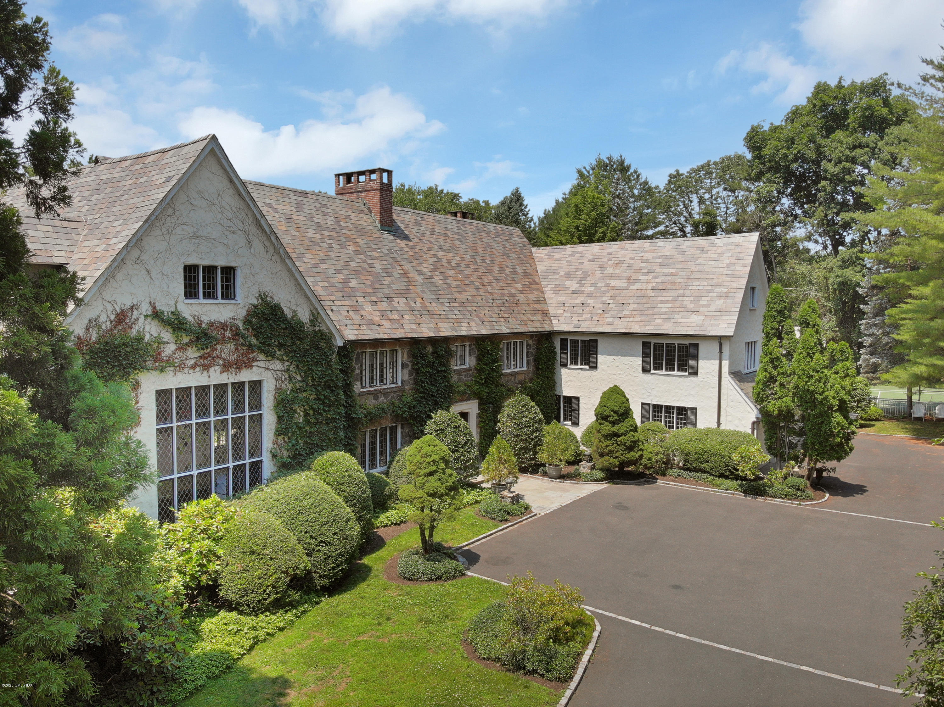 558 Lake Avenue Greenwich, CT 06830 - Photo 3 of 28 front view of a house with a yard