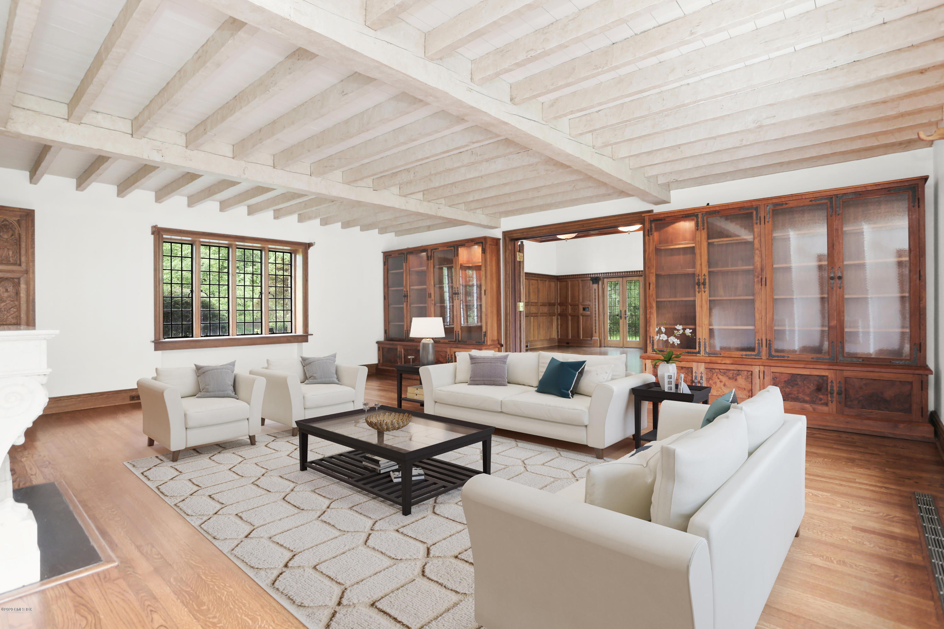 558 Lake Avenue Greenwich, CT 06830 - Photo 5 of 28 a living room with furniture and a large window