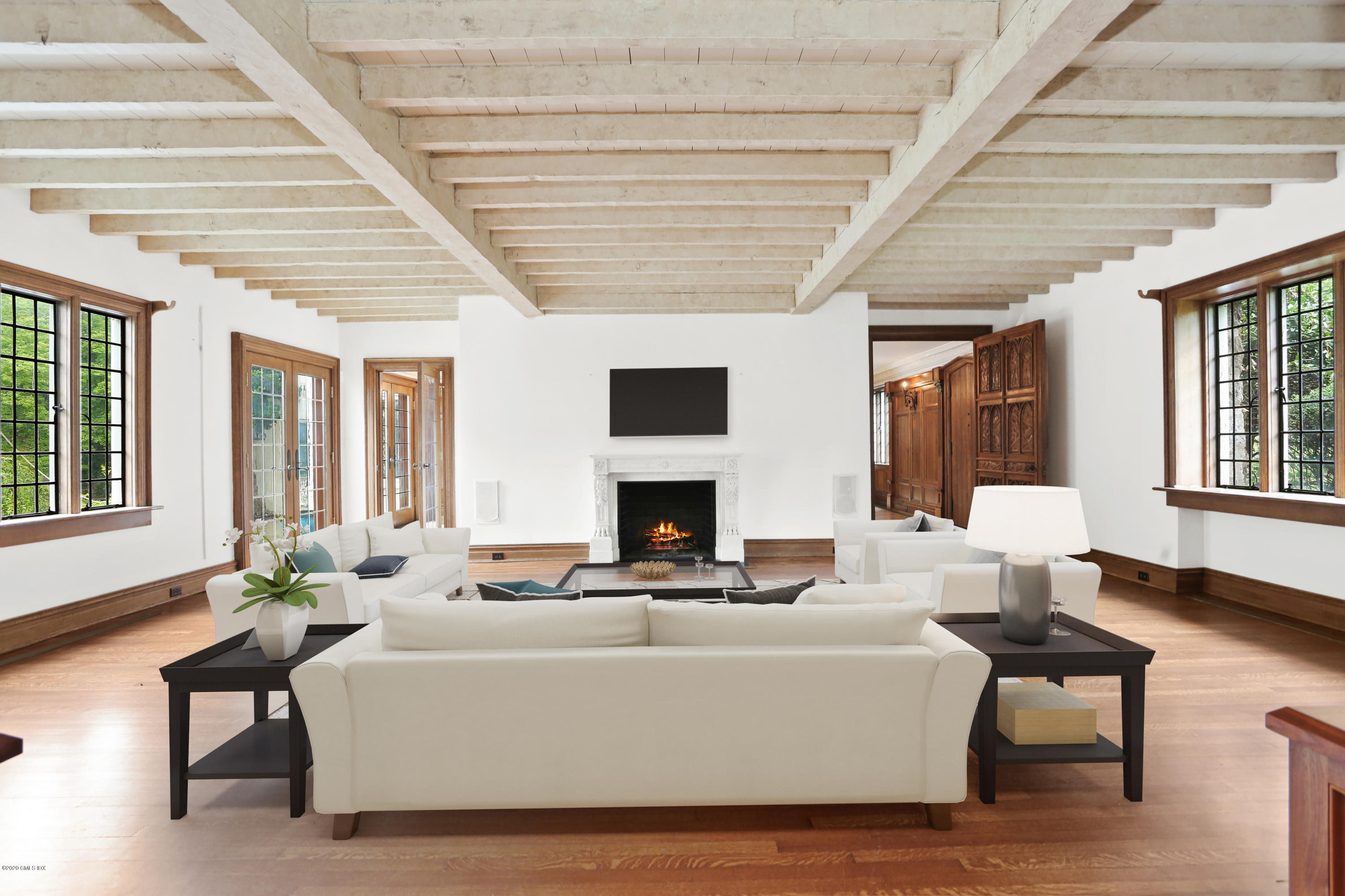 558 Lake Avenue Greenwich, CT 06830 - Photo 6 of 28 a living room with furniture a fireplace and a large window