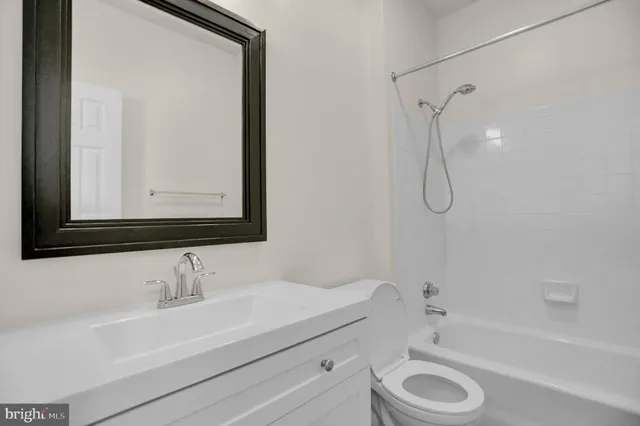 a bathroom with a sink a toilet and a bathtub