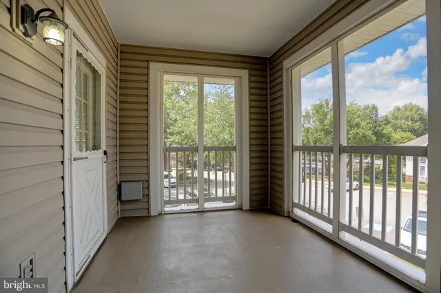 a view of a room with large windows