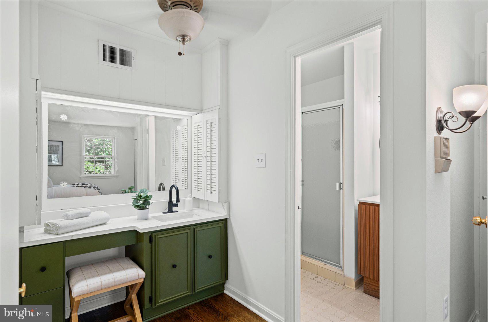 2300 Musgrove Road Silver Spring, MD 20904 - Photo 16 of 41 a bathroom with a sink vanity and a mirror