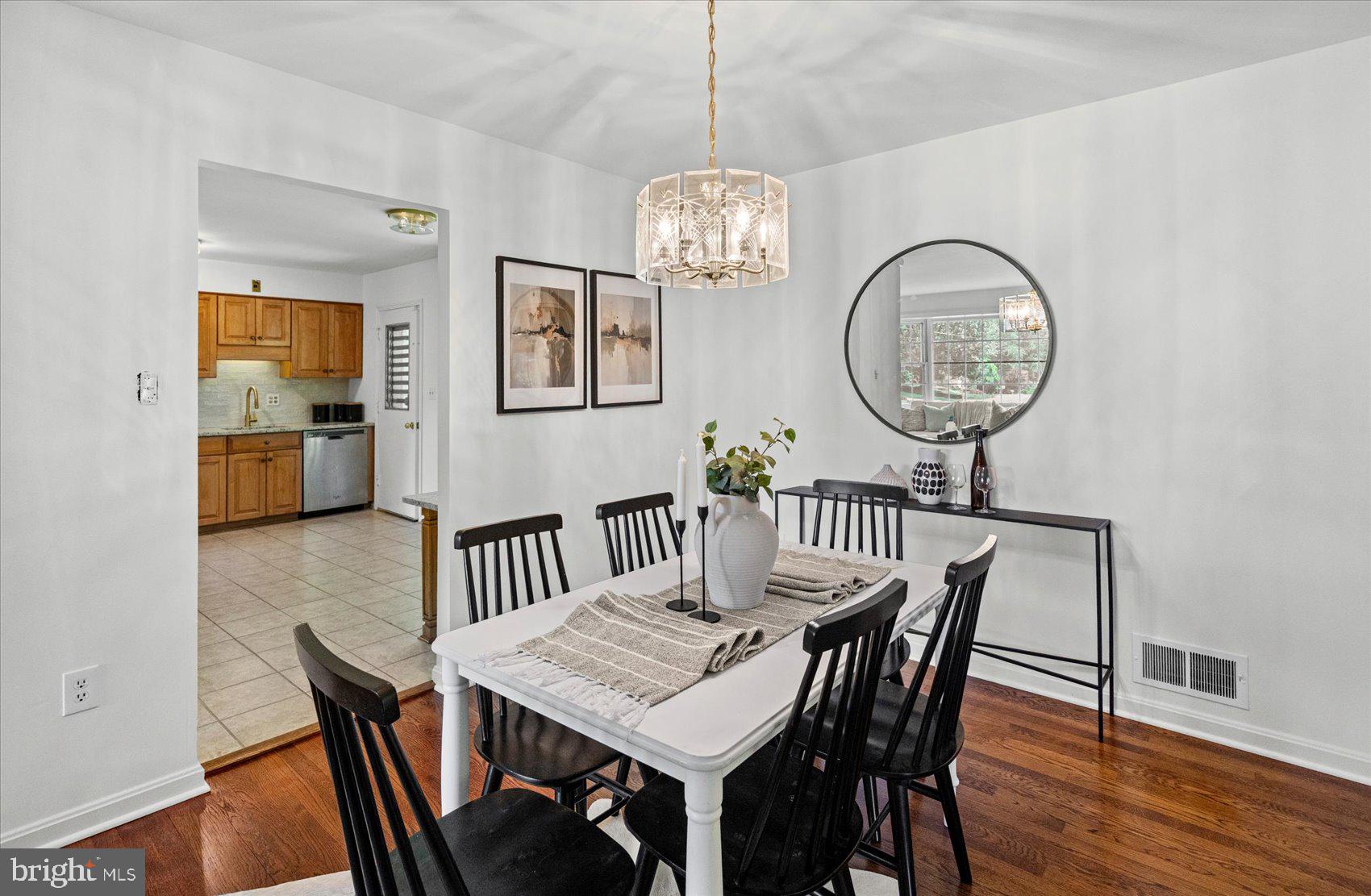 2300 Musgrove Road Silver Spring, MD 20904 - Photo 19 of 41 a view of a dining room with furniture wooden floor and chandelier