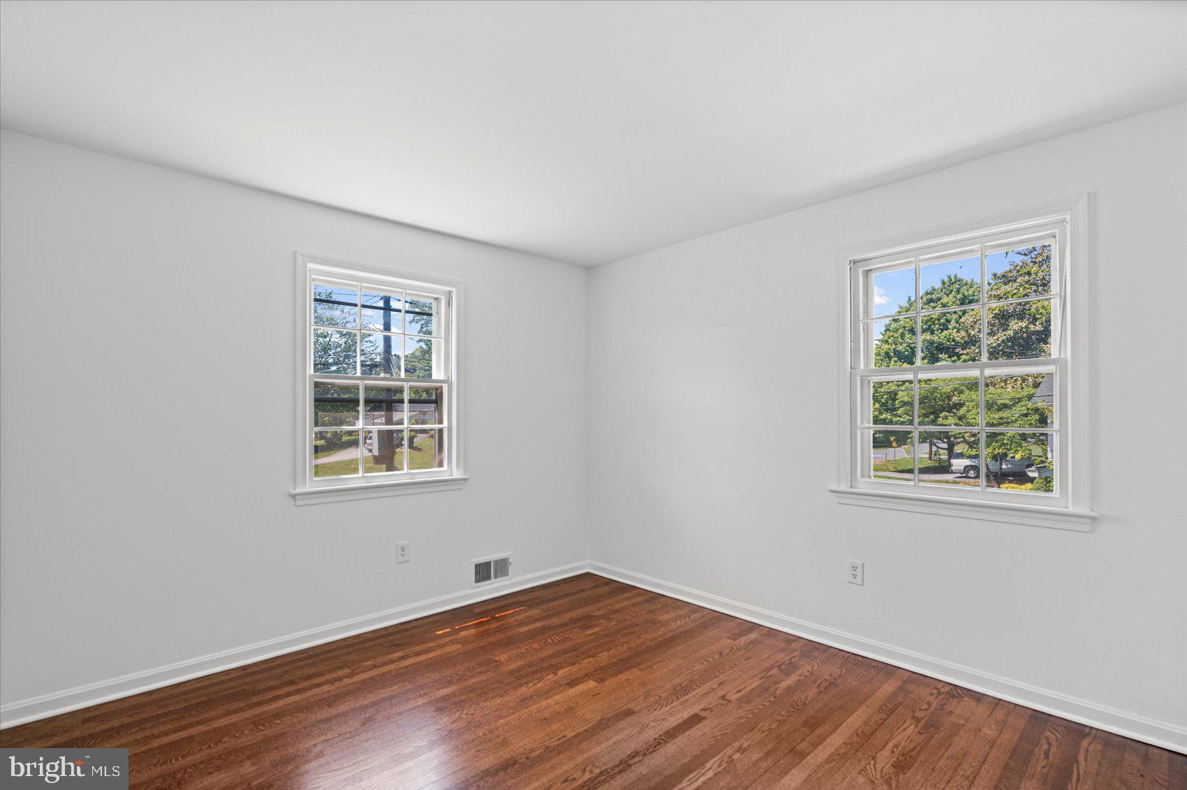 2300 Musgrove Road Silver Spring, MD 20904 - Photo 10 of 41 an empty room with wooden floor and windows