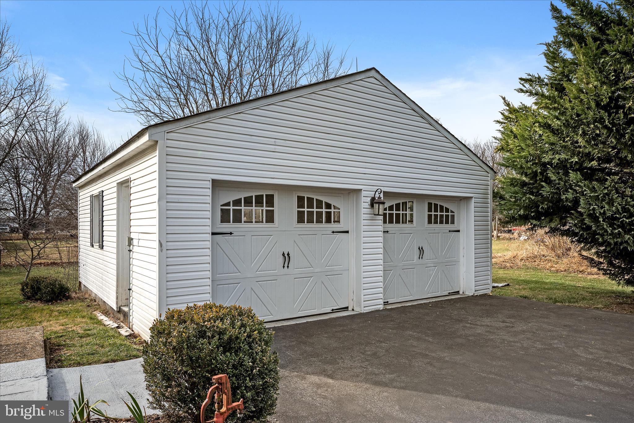 129 Church Street Summit Point, WV 25446 - Photo 14 of 81 a front view of a house with a garage