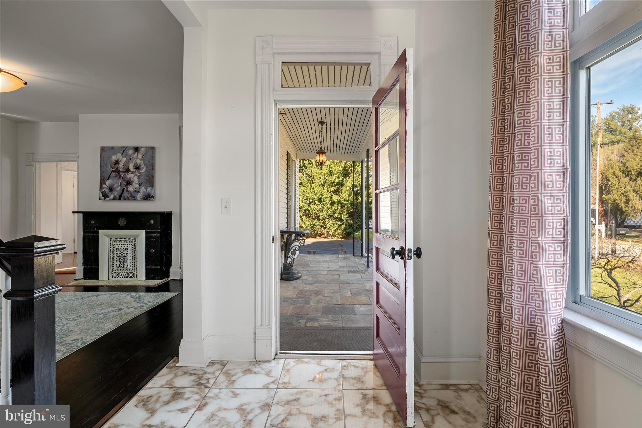 129 Church Street Summit Point, WV 25446 - Photo 28 of 91 a view of a hallway with wooden floor and a livingroom