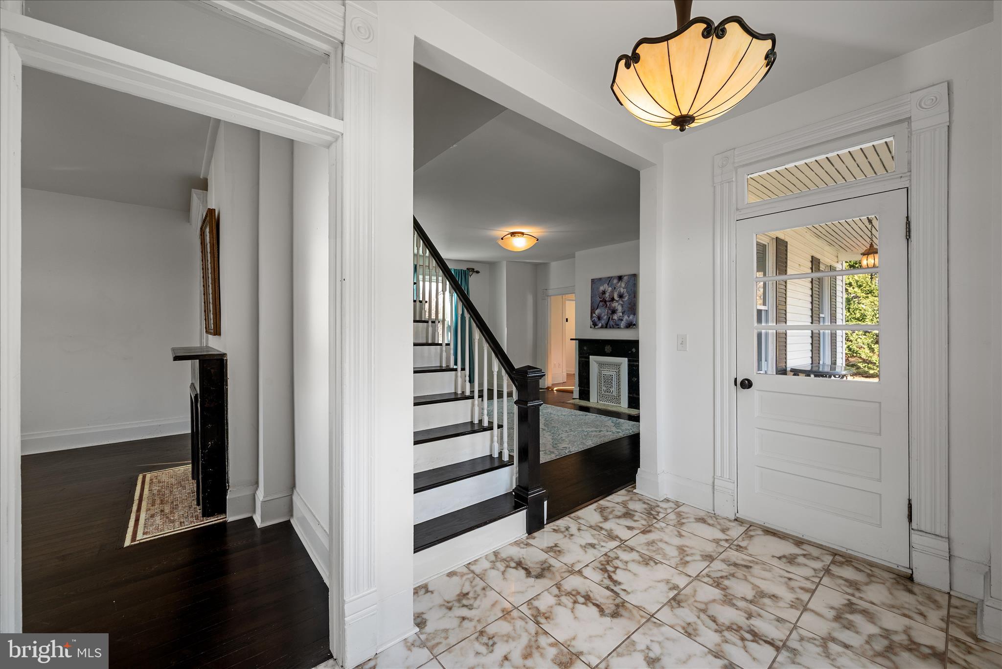 129 Church Street Summit Point, WV 25446 - Photo 33 of 91 a view of a hallway with wooden floor and staircase