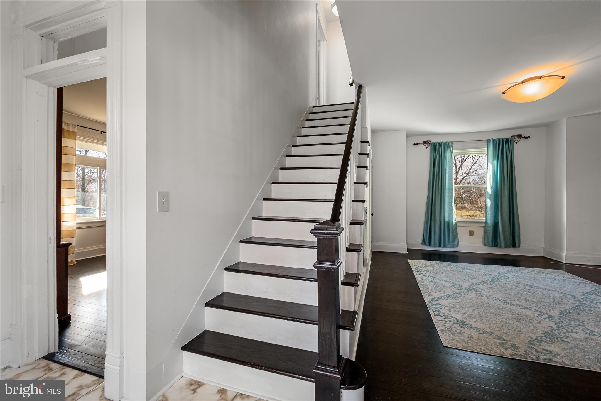 129 Church Street Summit Point, WV 25446 - Photo 34 of 91 a view of a hallway with wooden floor and staircase